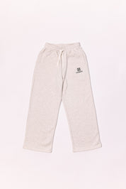 Beige sweatpants with a logo on a light background