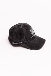 Black cap with white text on a white background