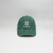 Green cap with Incarnie logo on a white background