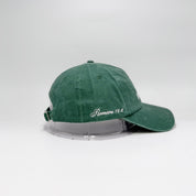 Green cap with text on a white background